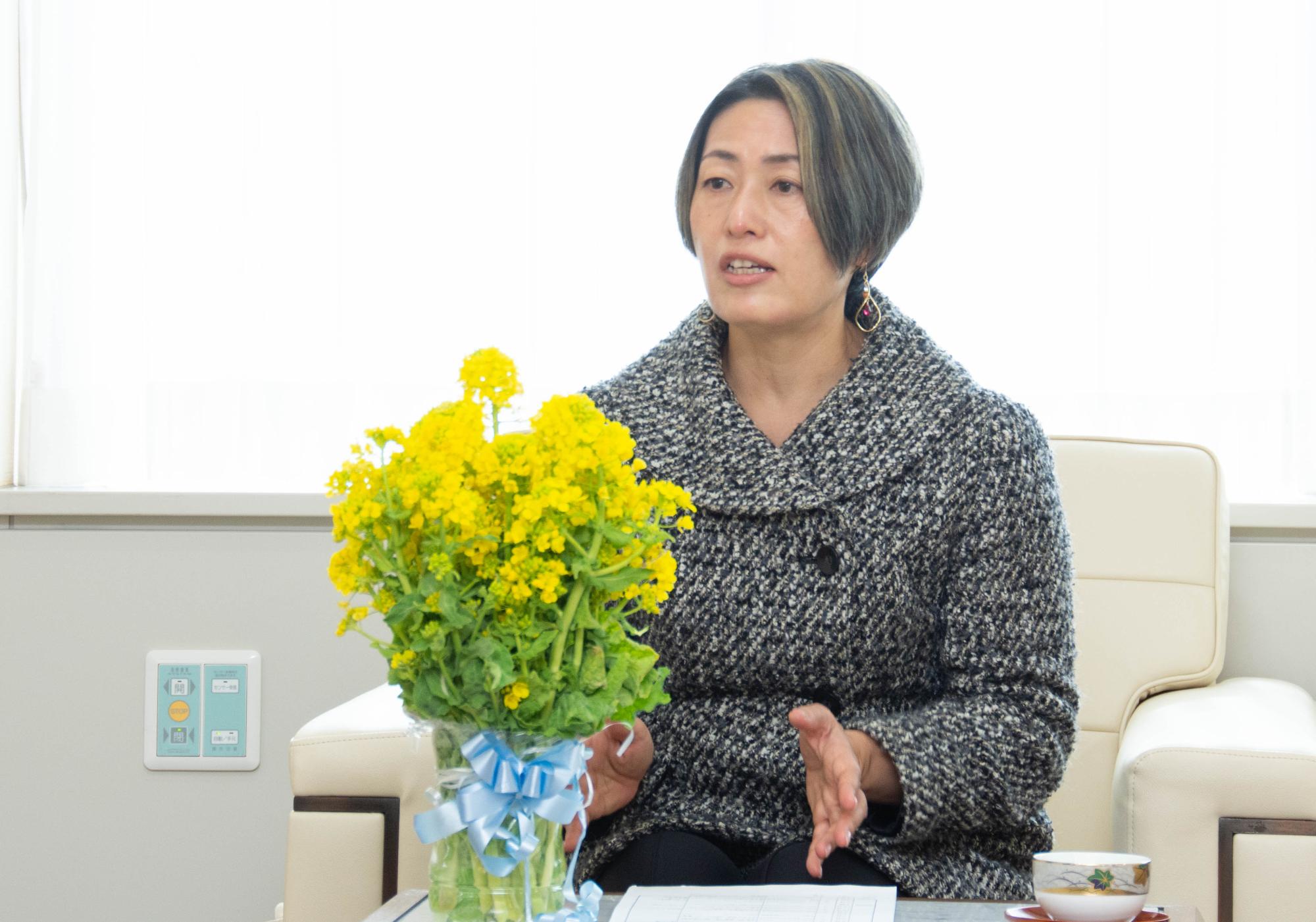 活動報告をする梅谷会長